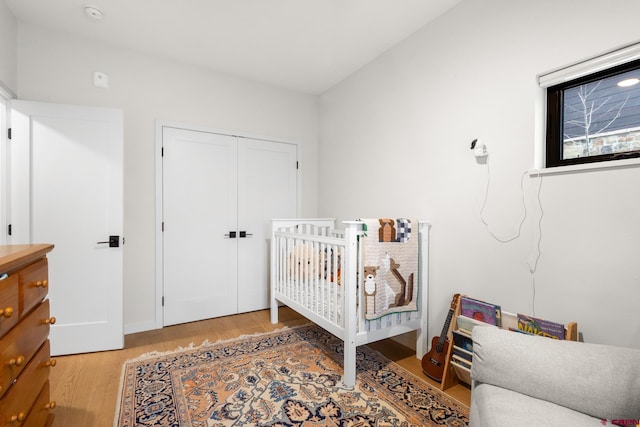 bedroom featuring light hardwood / wood-style flooring and a closet