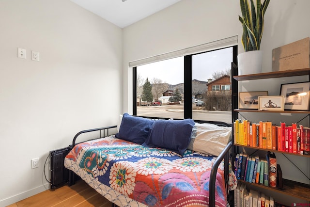 bedroom with hardwood / wood-style floors