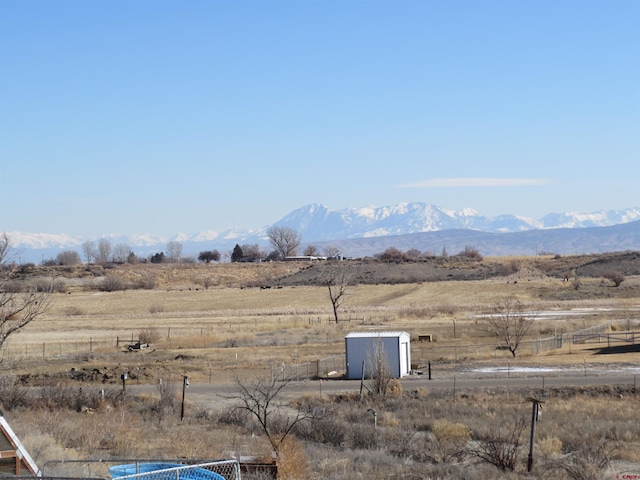 mountain view featuring a rural view