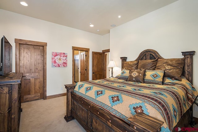 bedroom featuring light colored carpet