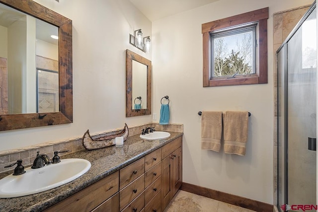 bathroom featuring tile patterned flooring, vanity, plenty of natural light, and walk in shower