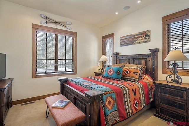 bedroom featuring light carpet