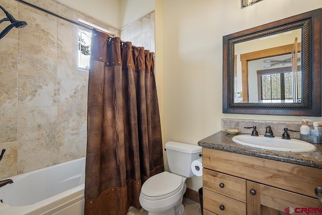 full bathroom with shower / tub combo with curtain, vanity, and toilet