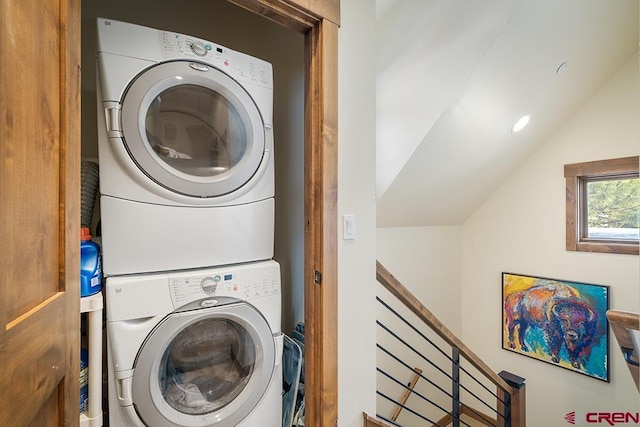 laundry room with stacked washer / drying machine