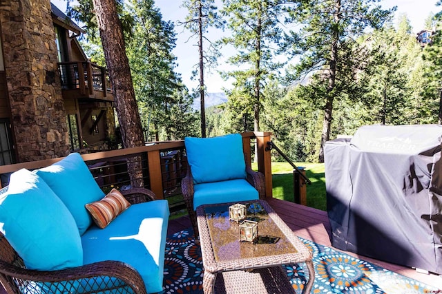 wooden deck featuring grilling area