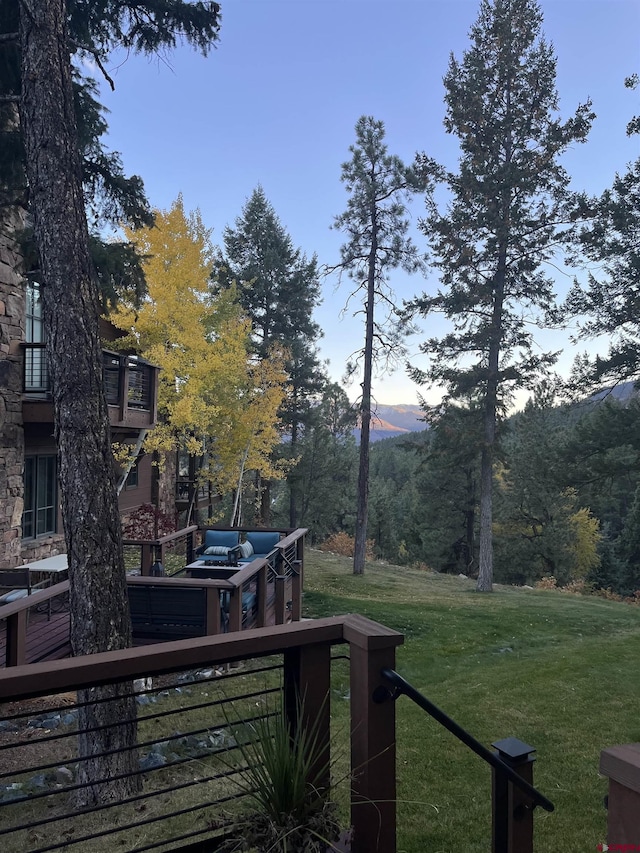 yard at dusk with a deck