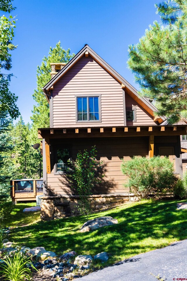 view of home's exterior with a lawn