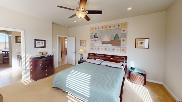 bedroom featuring ceiling fan and light colored carpet