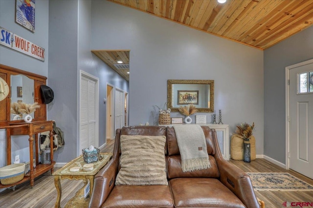 foyer entrance with hardwood / wood-style flooring, a high ceiling, and wood ceiling