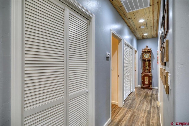 corridor featuring wood-type flooring