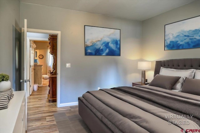 bedroom with light hardwood / wood-style floors