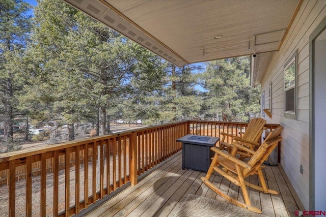 deck with an outdoor fire pit