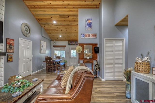 living room featuring dark wood-type flooring, wood ceiling, and high vaulted ceiling