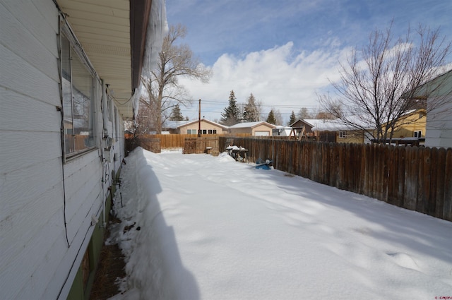 view of yard covered in snow