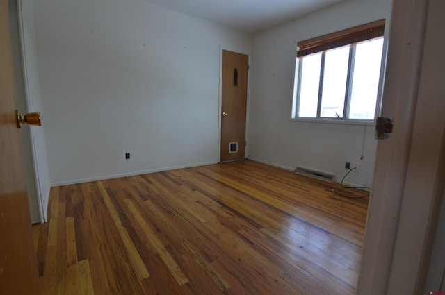 unfurnished bedroom featuring dark wood-type flooring