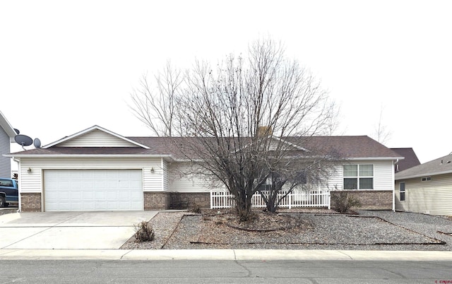 ranch-style home with driveway and an attached garage