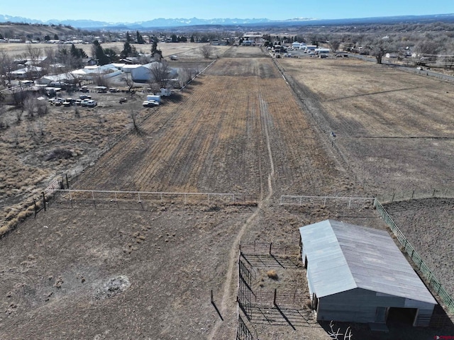 drone / aerial view with a rural view and a mountain view