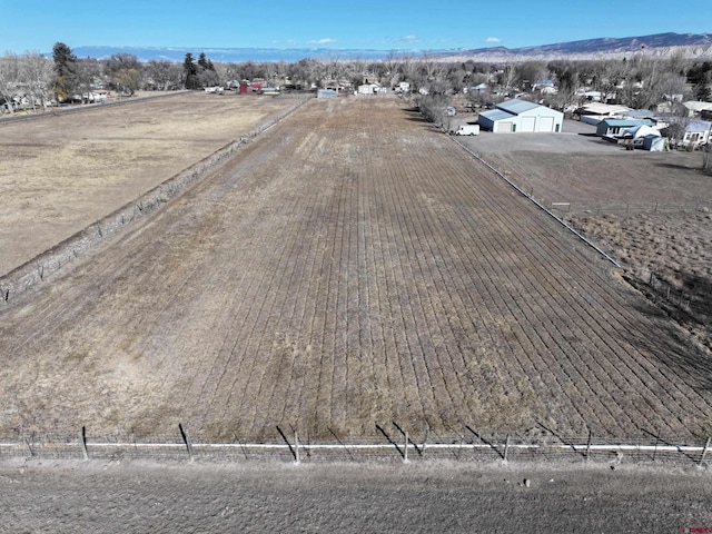 birds eye view of property featuring a rural view