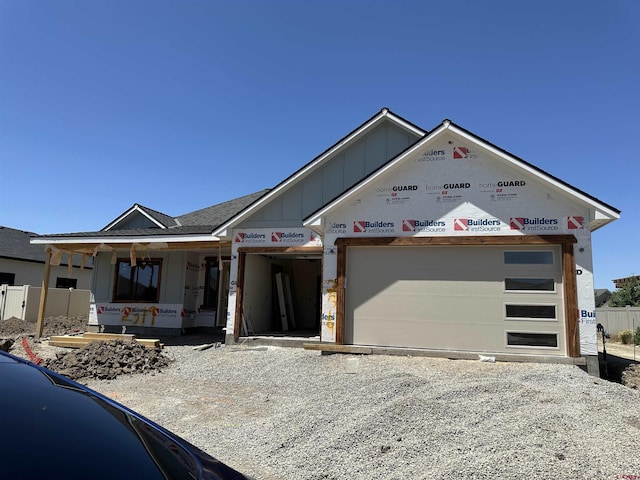 2319 Stone Bridge Dr, Montrose, CO 81401 - property in mid-construction featuring a garage, board and batten siding, a porch, and driveway
