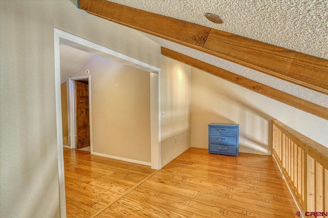 additional living space featuring light hardwood / wood-style flooring