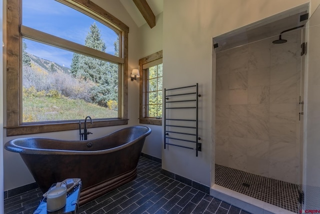 bathroom featuring a mountain view, independent shower and bath, and beam ceiling