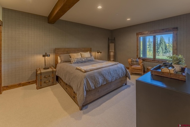 bedroom with carpet flooring and beam ceiling