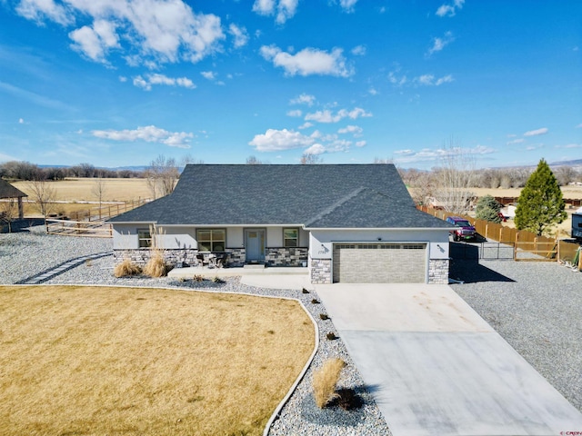 view of front of home with a front lawn and a garage