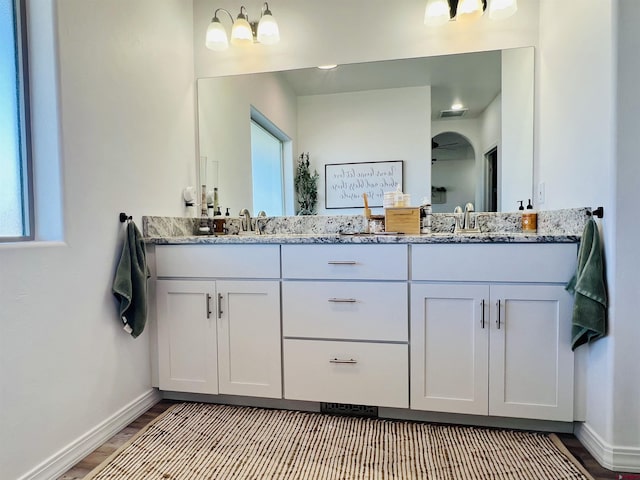 bathroom featuring vanity and wood-type flooring