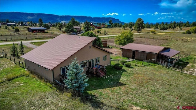 drone / aerial view featuring a mountain view and a rural view