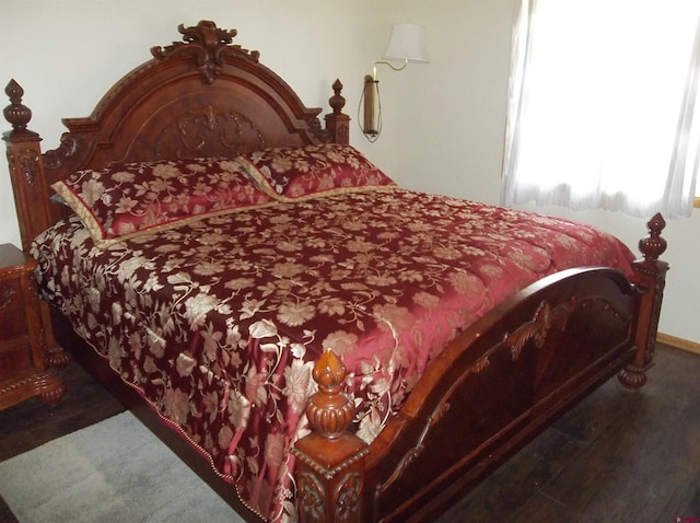 bedroom featuring dark wood-type flooring