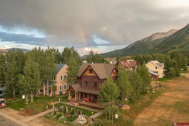 birds eye view of property featuring a mountain view