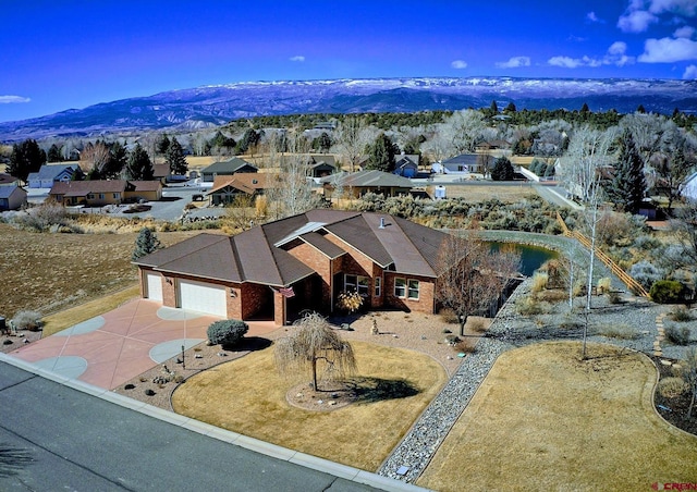 drone / aerial view featuring a mountain view