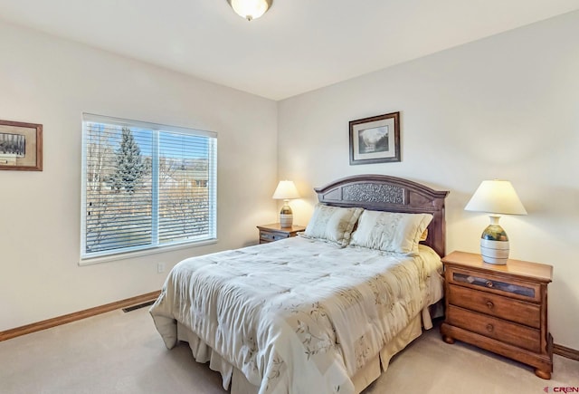 bedroom with light carpet