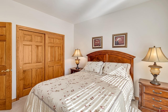 carpeted bedroom featuring a closet