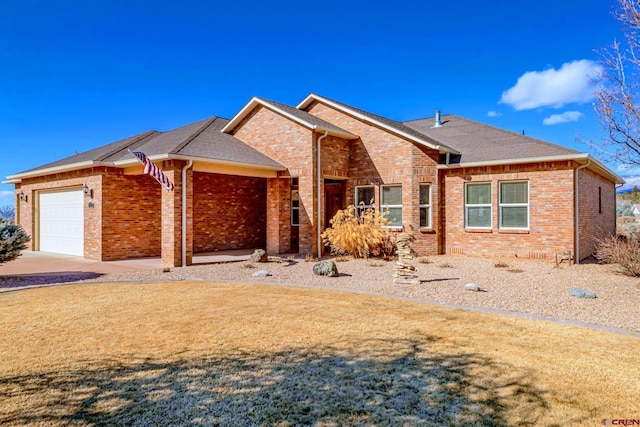 view of front of home with a garage and a front lawn