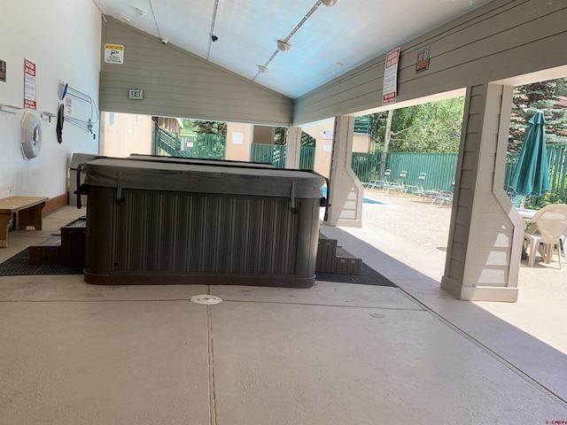 view of patio / terrace with a hot tub