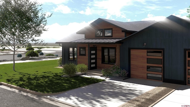 contemporary house featuring metal roof, concrete driveway, a standing seam roof, and an attached garage