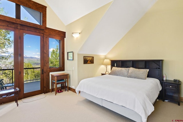 bedroom featuring access to outside, light colored carpet, vaulted ceiling, and baseboards