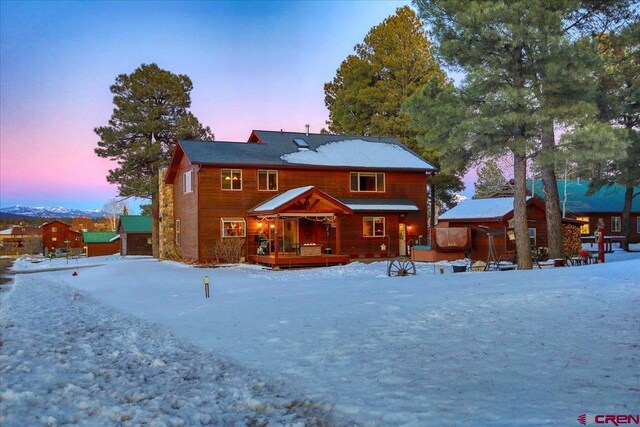 view of snow covered house