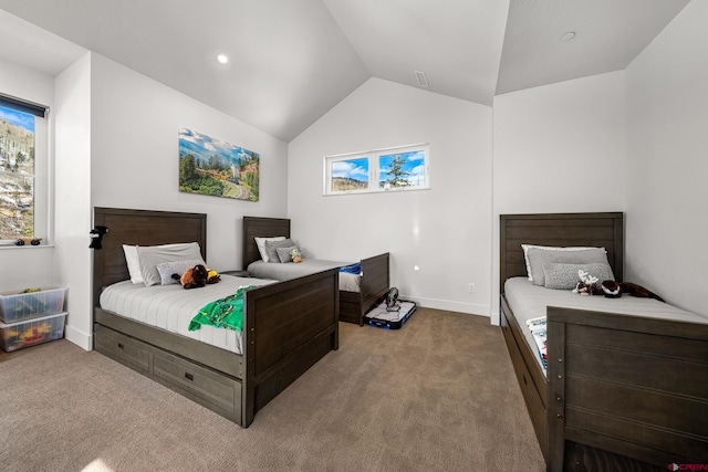 bedroom featuring light carpet, vaulted ceiling, and baseboards