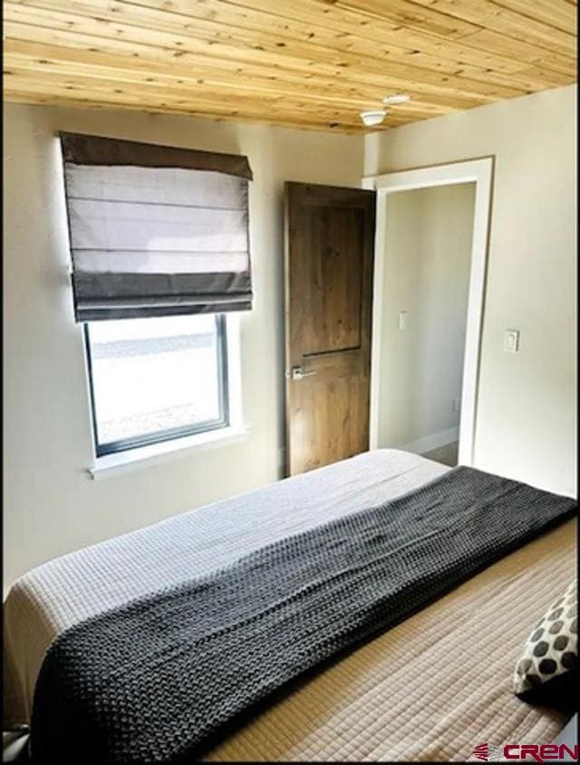 bedroom with wood ceiling