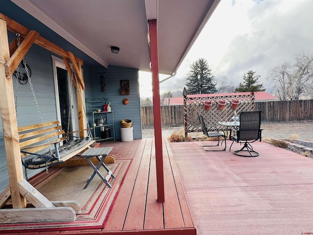 deck with fence and outdoor dining space