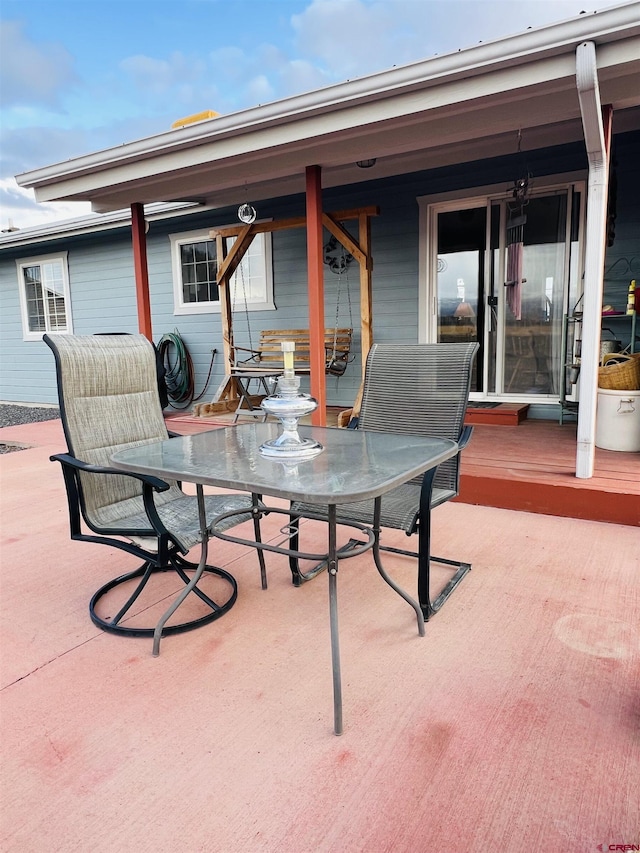 view of patio featuring outdoor dining area