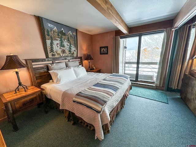 bedroom featuring access to outside, carpet flooring, beamed ceiling, and a textured ceiling