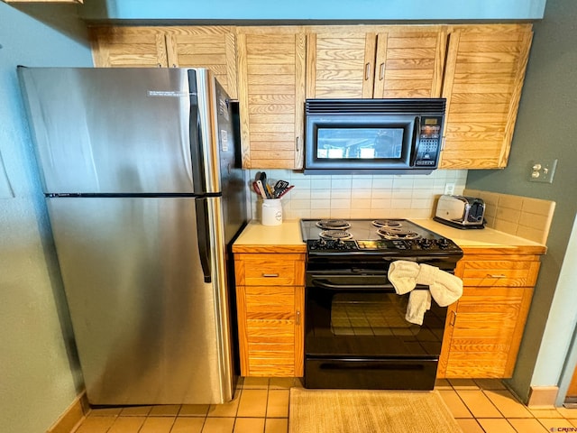 kitchen with decorative backsplash, light countertops, black appliances, and light tile patterned flooring