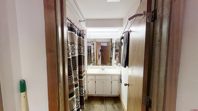 full bathroom featuring vanity and wood finished floors