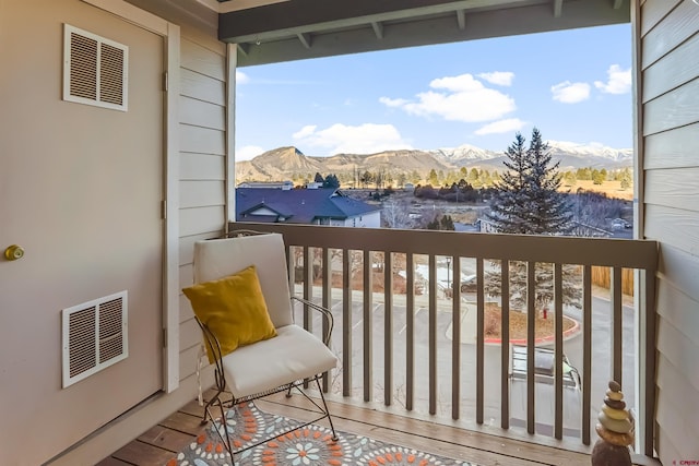 balcony with visible vents and a mountain view