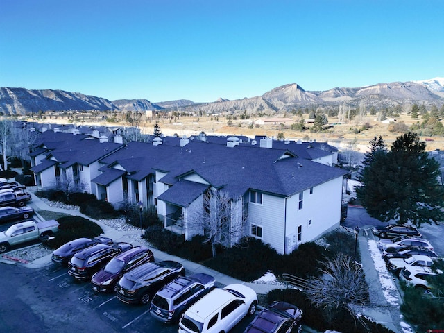 aerial view featuring a mountain view and a residential view