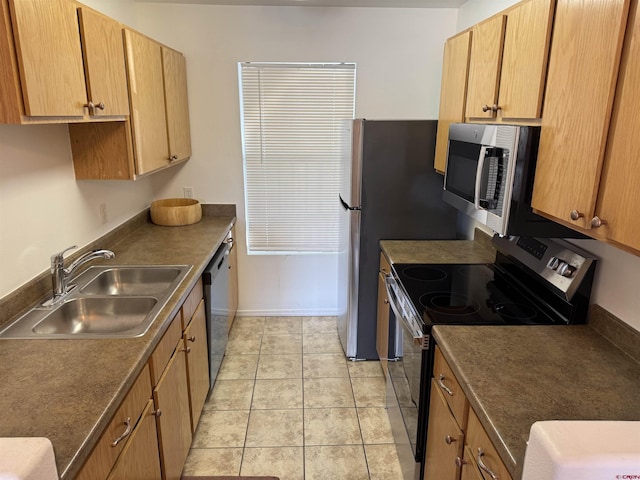 kitchen with light tile patterned floors, appliances with stainless steel finishes, brown cabinetry, and a sink