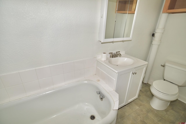 bathroom featuring a tub to relax in, toilet, and vanity